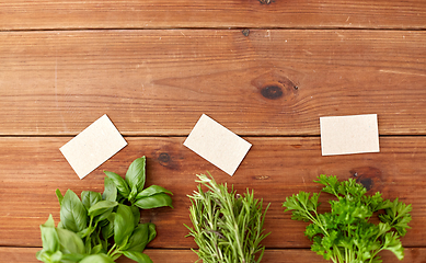 Image showing greens, spices or medicinal herbs on wooden boards