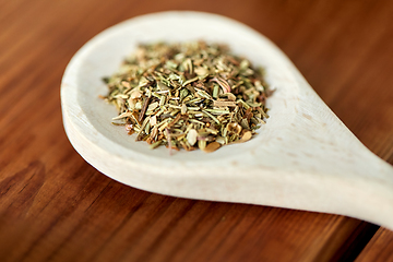 Image showing close up of dry spices on wooden spoon