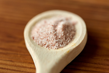 Image showing close up of wooden spoon with pink himalayan salt