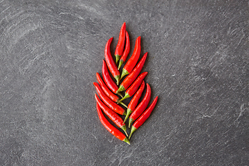 Image showing red chili or cayenne pepper on slate stone surface