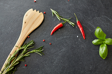 Image showing rosemary, basil and chili pepper on stone surface