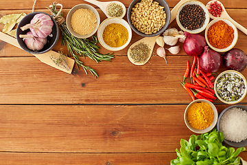 Image showing spices, onion, garlic, pine nuts and chili peppers