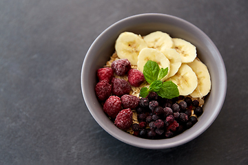 Image showing cereal breakfast with berries, banana and mint