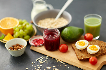 Image showing jam, toast bread, eggs, avocado, cherry tomatoes