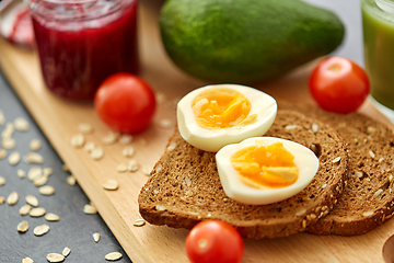 Image showing toast bread with eggs, cherry tomatoes and avocado