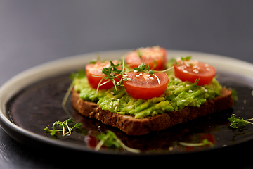 Image showing toast bread with mashed avocado and cherry tomato