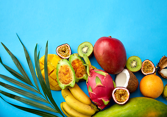 Image showing different exotic fruits on blue background