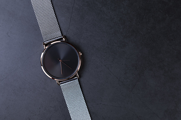 Image showing Wrist watch with metal strap for women on gray background