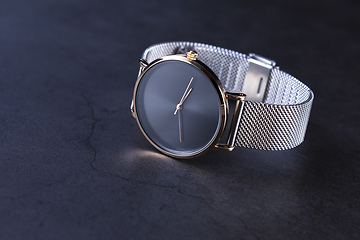 Image showing Wrist watch with metal strap for women on gray background