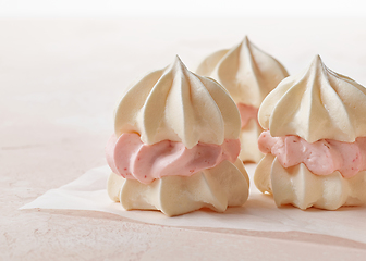 Image showing meringue cakes on pink background