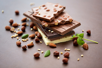 Image showing close up of different chocolate bars and nuts