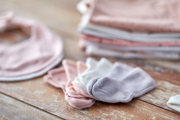 Image showing close up of baby clothes on wooden table