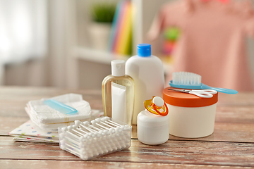 Image showing baby accessories for bathing on wooden table