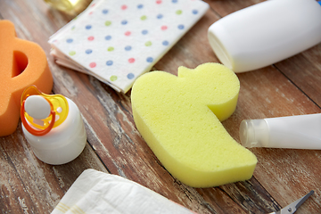 Image showing baby accessories for bathing on wooden table