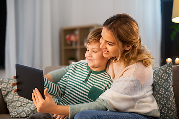 Image showing mother and son using tablet computer at home