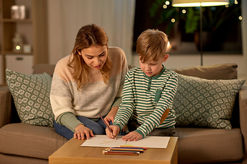 Image showing mother and son with pencils drawing at home