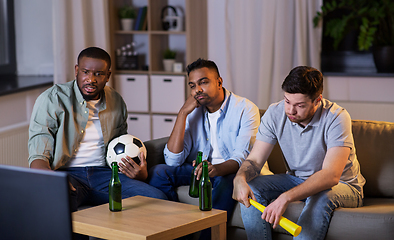 Image showing friends with ball and vuvuzela watching soccer