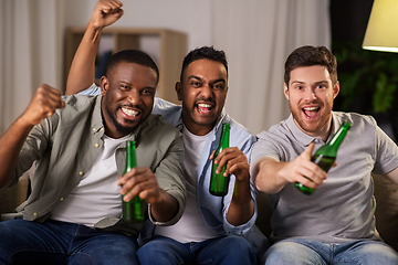 Image showing happy male friends or fans drinking beer at home