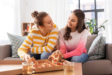 Image showing happy teenage girls eating takeaway pizza at home