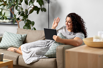 Image showing woman with tablet pc having video chat at home