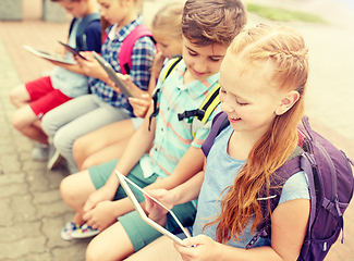 Image showing group of happy elementary school students talking