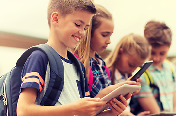 Image showing group of happy elementary school students talking