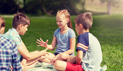 Image showing happy kids playing rock-paper-scissors game