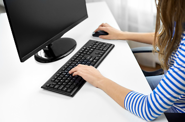 Image showing close up of teenage girl with computer at home