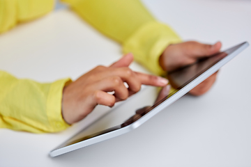 Image showing hands of african american woman with tablet pc
