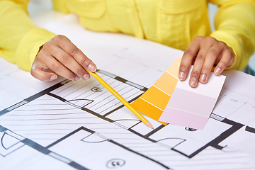 Image showing architect with blueprint and color palettes