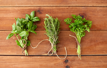 Image showing greens, spices or medicinal herbs on wooden boards