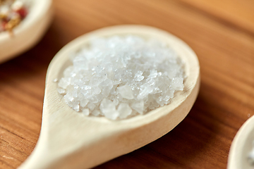 Image showing close up of wooden spoon with sea salt