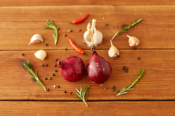 Image showing onion, garlic, chili pepper and rosemary on table