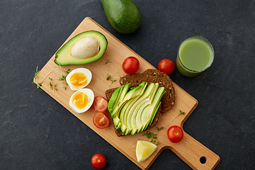 Image showing toast bread with avocado, eggs and cherry tomatoes