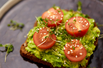 Image showing toast bread with mashed avocado and cherry tomato