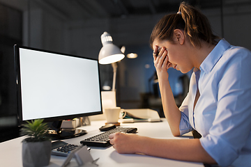 Image showing sad businesswoman with computer at night office