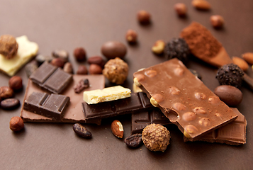 Image showing chocolate with nuts, cocoa beans and powder