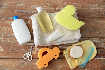 Image showing baby accessories for bathing on wooden table