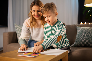 Image showing mother and son with pencils drawing at home