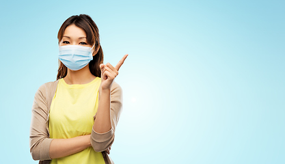 Image showing asian young woman in protective medical mask