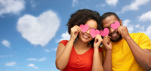 Image showing happy african american couple with hearts