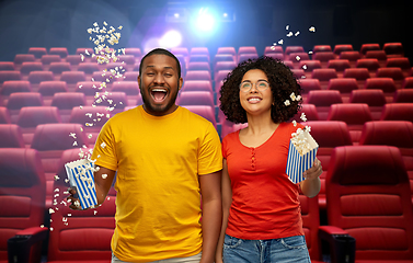 Image showing happy friends watching movie in theater