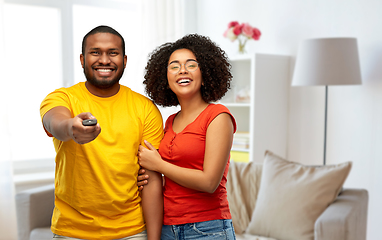 Image showing african american couple with tv remote control