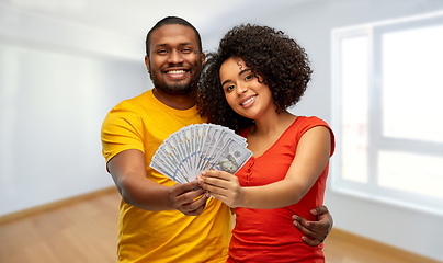 Image showing african american couple with money at new home