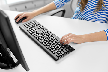 Image showing close up of teenage girl with computer at home