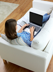 Image showing teenage student girl with laptop and books at home