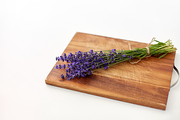 Image showing bunch of lavender flowers on wooden board