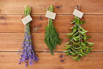 Image showing lavender, dill and peppermint on wooden background