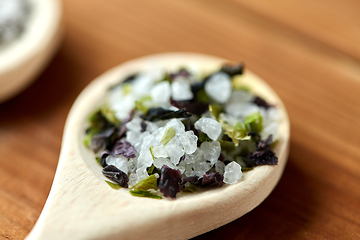 Image showing close up of wooden spoon with flavored sea salt