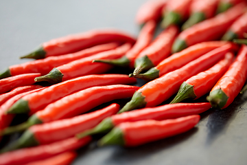 Image showing red chili or cayenne pepper on slate stone surface